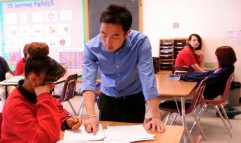 Teacher helping a student