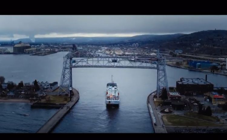 Ship going under a bridge