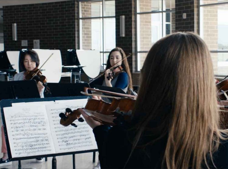 Orchestra Members Rehearsing