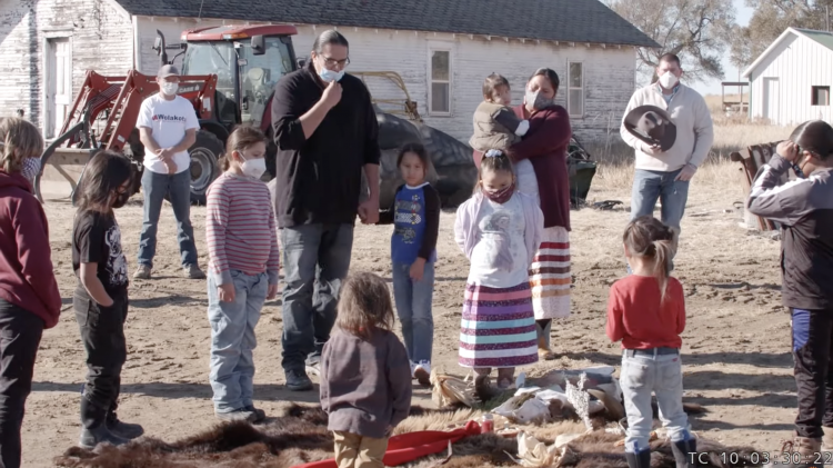 Tribe members at a ceremony at Wolakota.