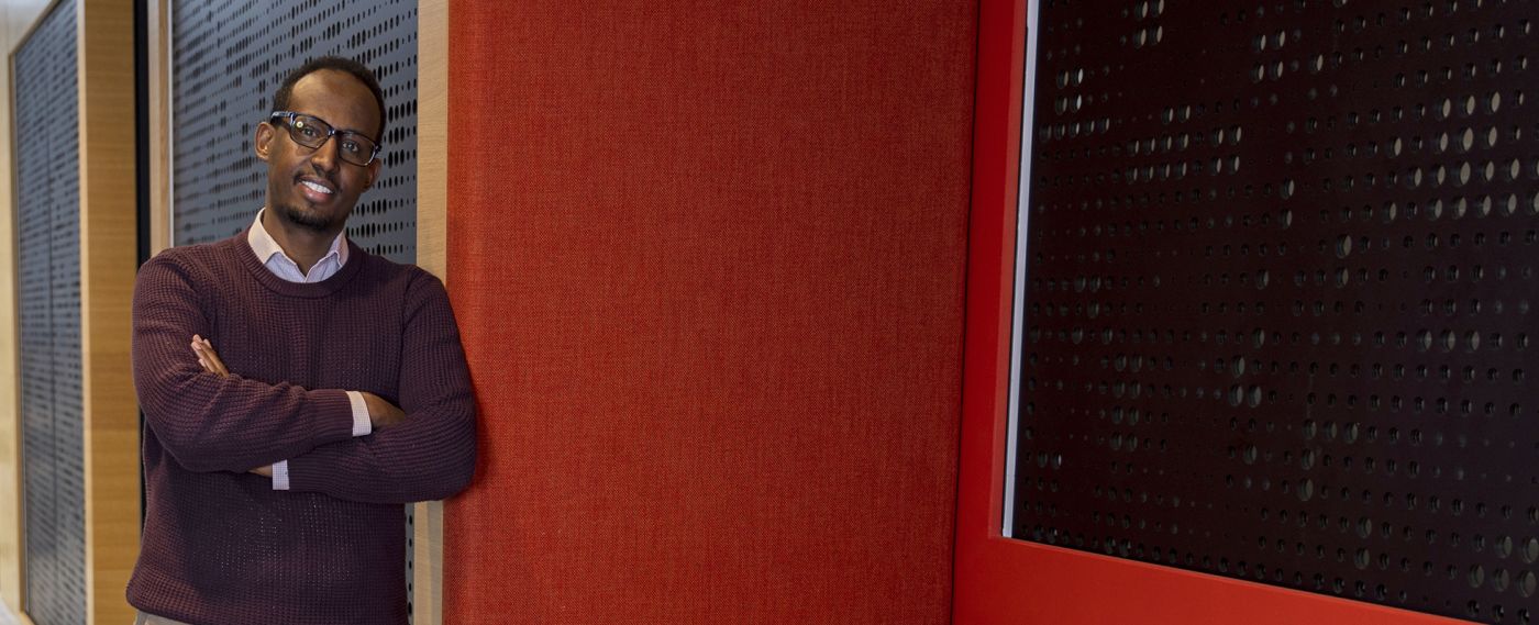 Mukhtar Ibrahim leaning against a wall