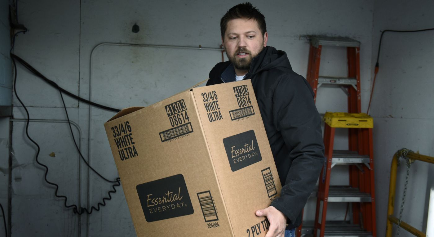 Alex Bata helps to load groceries onto a truck owned by the Rural Access Distribution co-op in North Dakota.