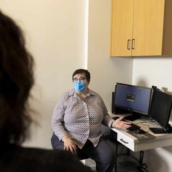 Nurse Jennifer Demma consults with a patient in a Family Tree Clinic office.