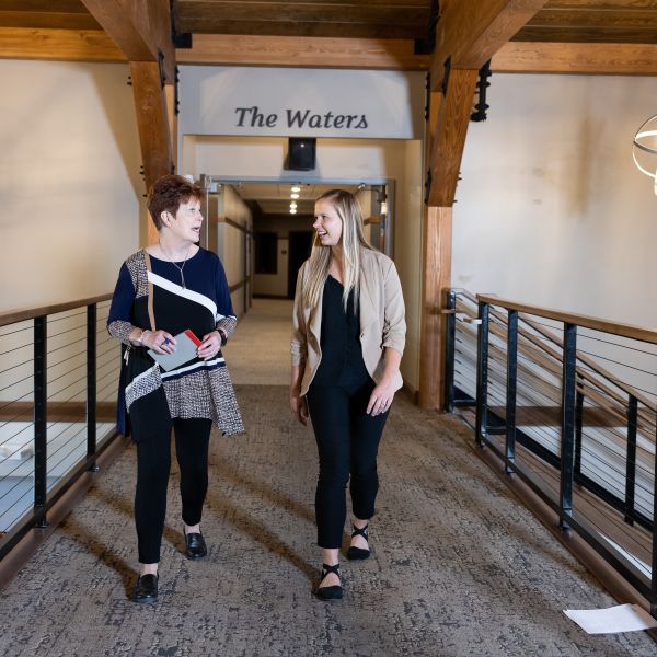 Diana Anderson and Baillee Krieger walk through halls of Bethesda