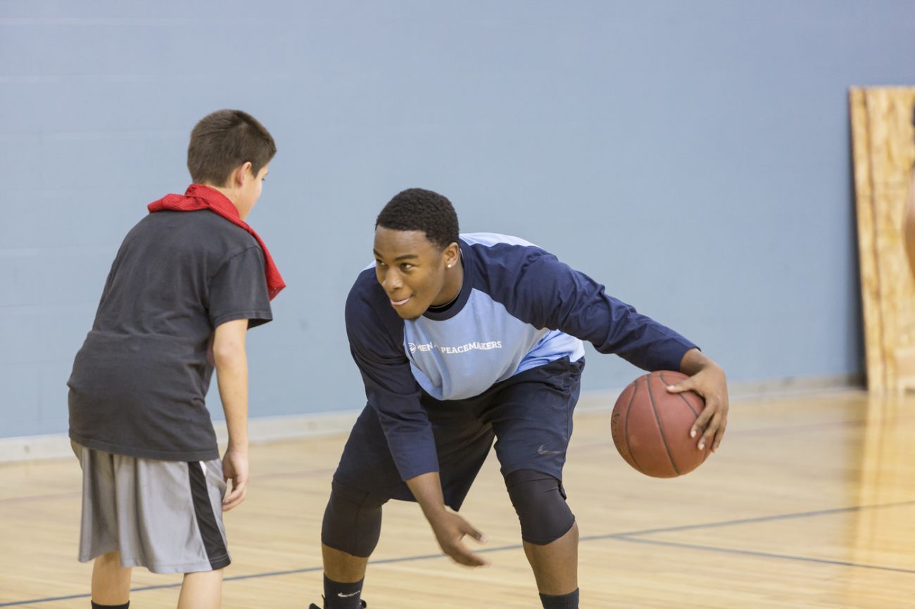 People playing basketball with kids