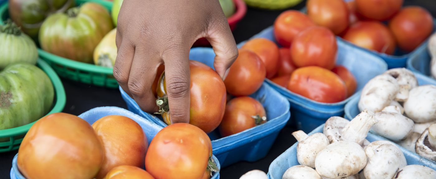 hand reaching for vegetable