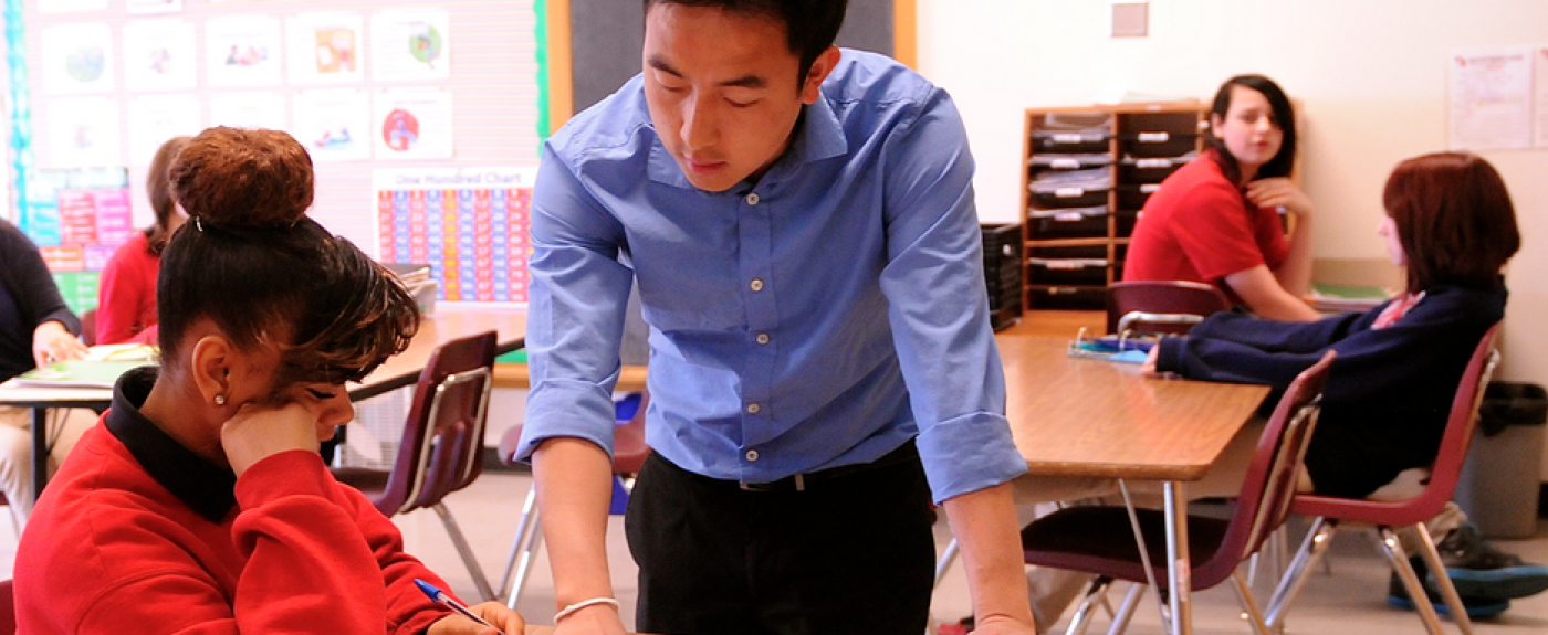 Teacher helping a student