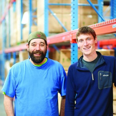 Two men in a warehouse