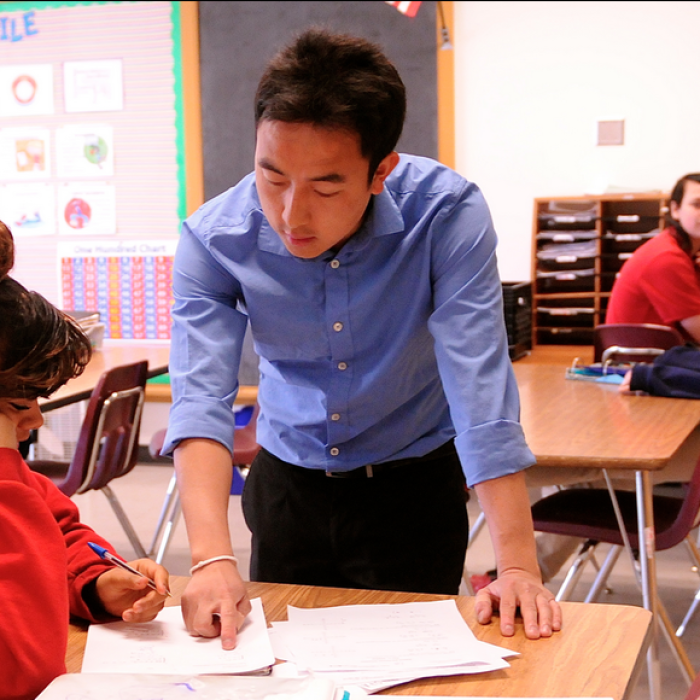 Teacher helping a student