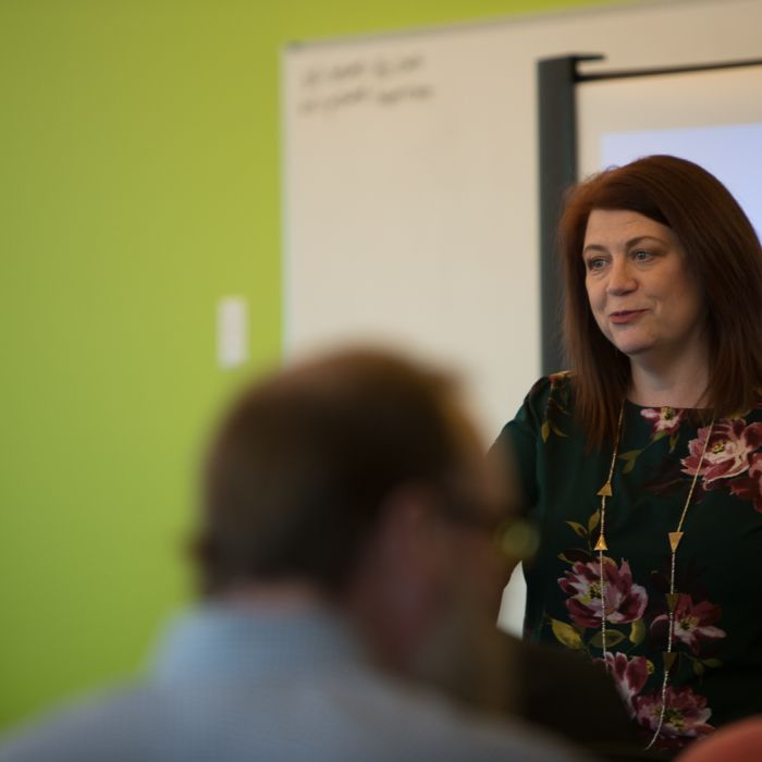 Amelia Franck Meyer speaking to a group of people